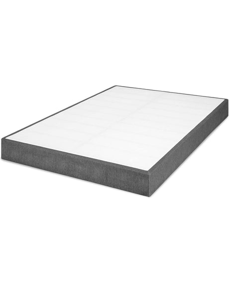 The completed box spring with a smooth, gray-upholstered surface, offering a noise-free and non-slip bed base.