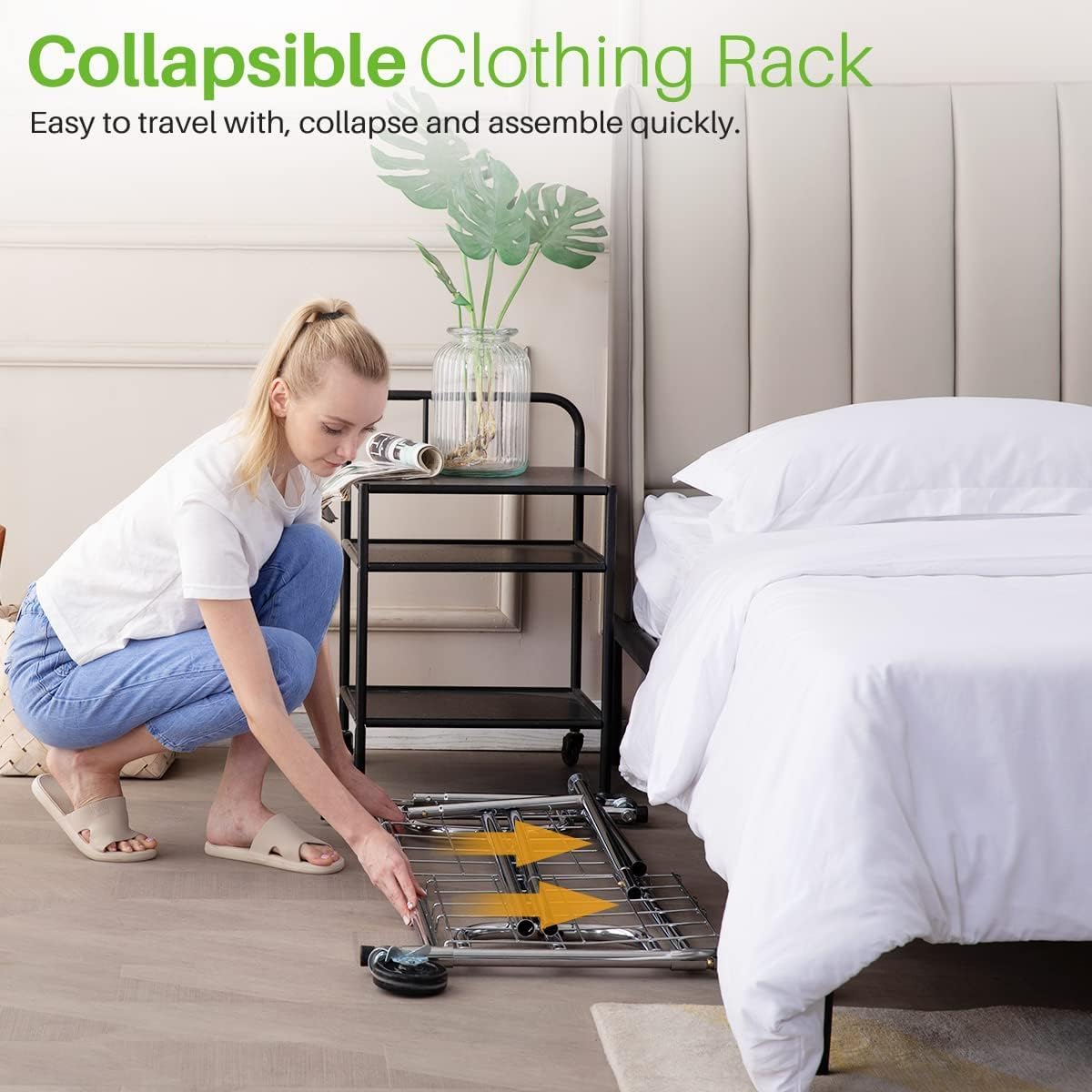 Collapsible clothing rack being folded by a woman, demonstrating its portable and space-saving design for travel or storage.