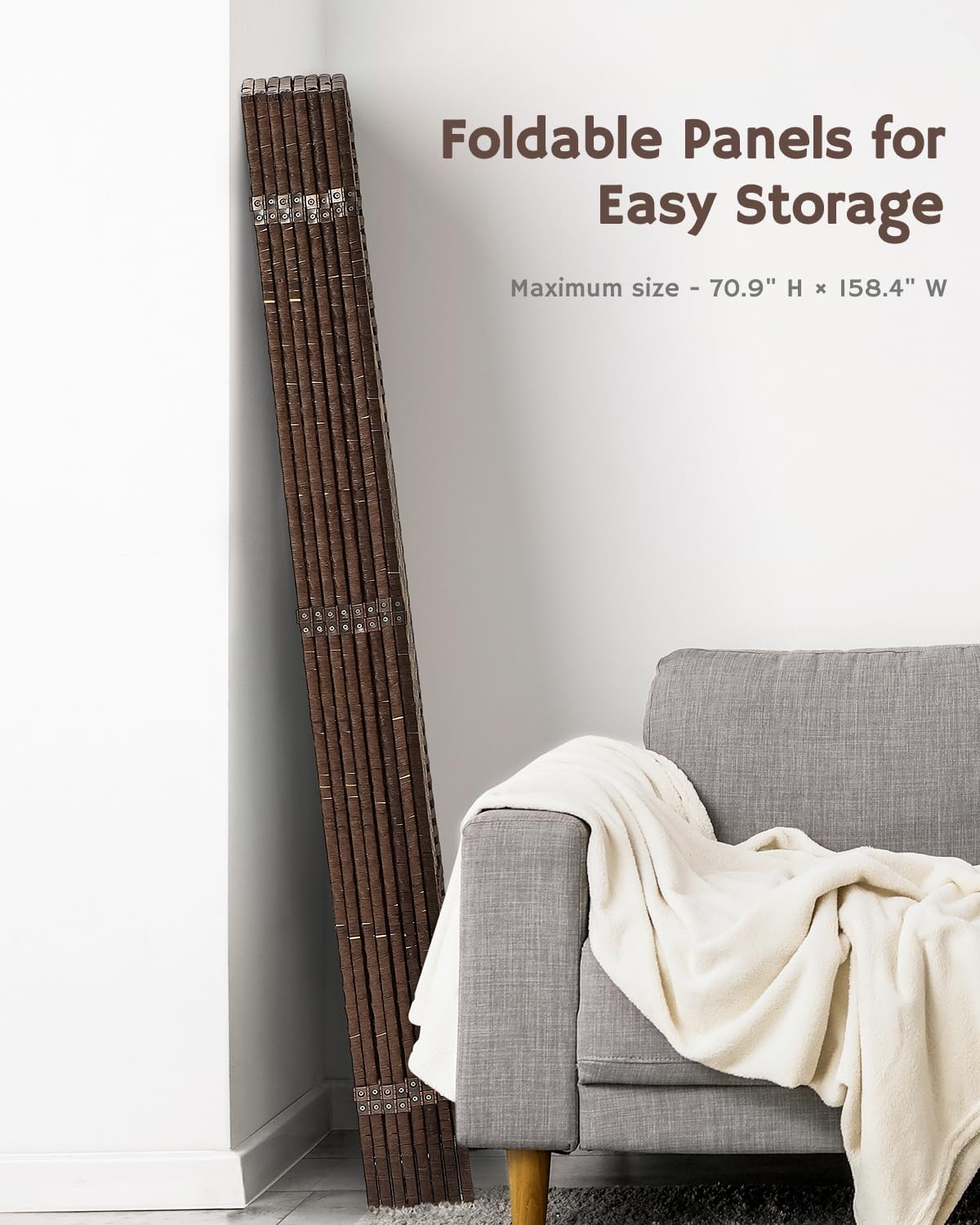 Compact folded bamboo room divider stored beside a gray armchair, highlighting its practical, space-saving design for modern living spaces.