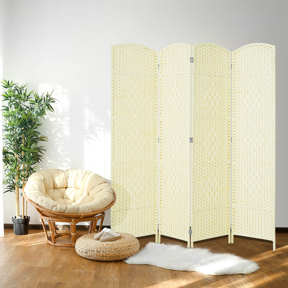 4-panel ivory white room divider displayed in a sunny living room with a papasan chair and potted plant, providing a light and elegant touch to the space.