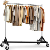 A black rolling clothing rack with a metal hanging bar, shown empty against a plain white studio background. A beige hat and a shoulder bag are placed on the left side as styling props.