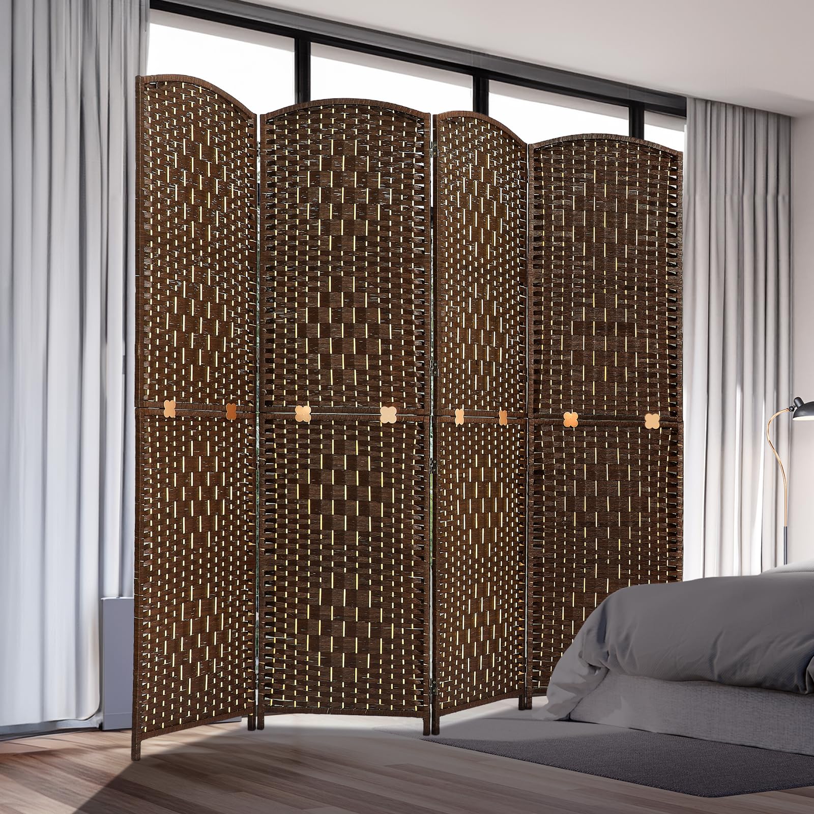 Room divider with four woven panels in natural bamboo and wood, displayed in a bedroom setting near a bed and curtains, offering privacy and style.