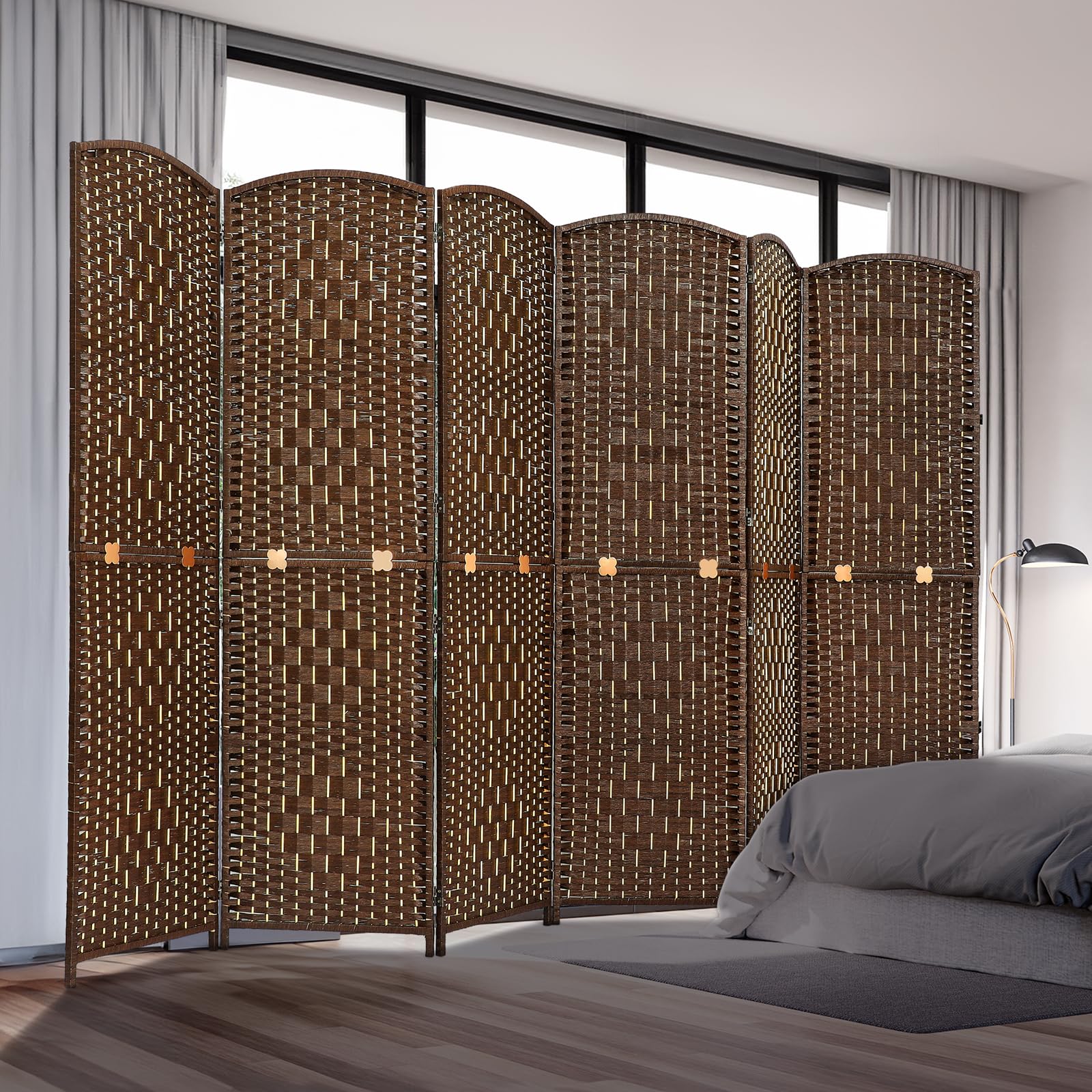 Room divider with six woven panels in natural bamboo and wood, displayed in a bedroom setting near a bed and curtains, offering privacy and style.