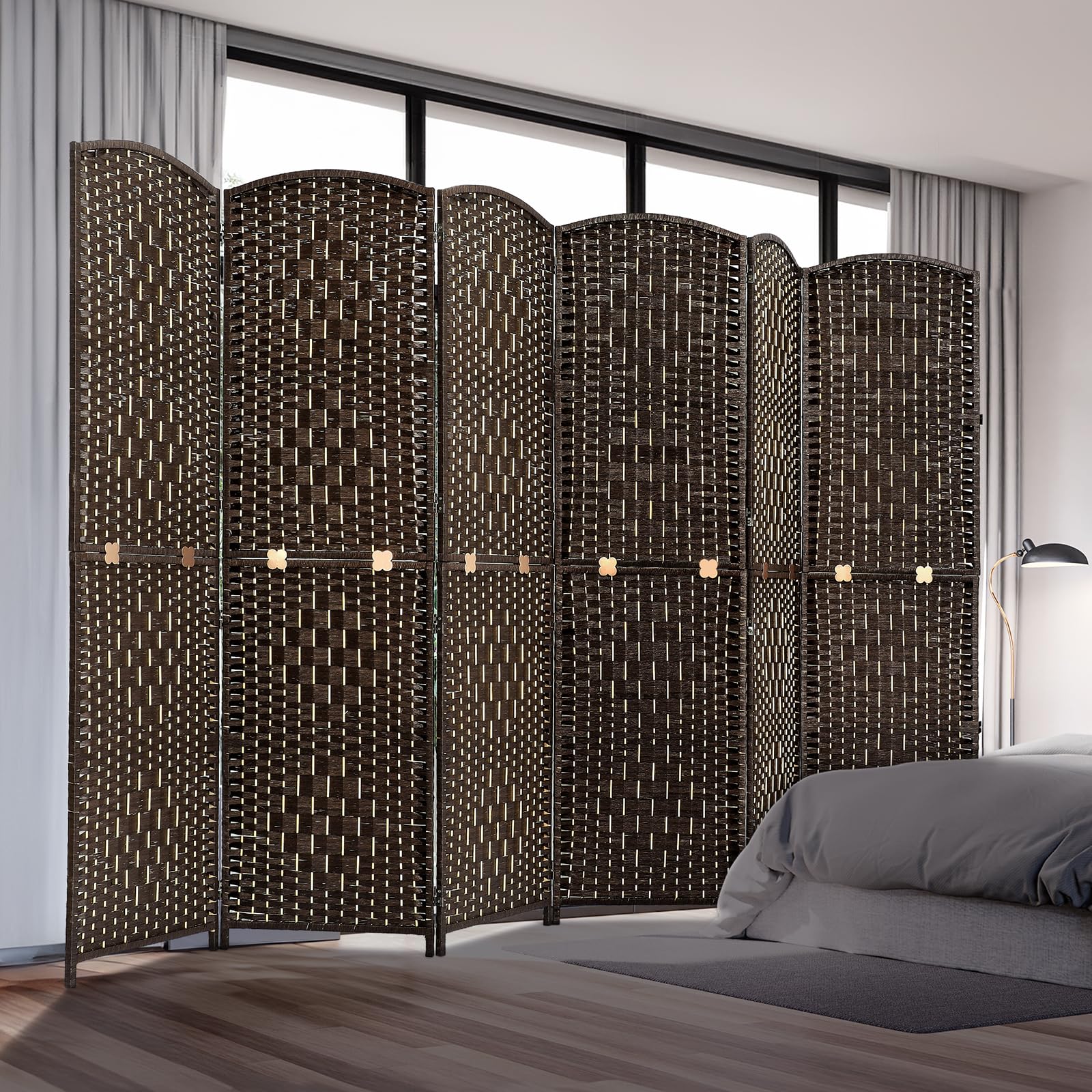 Room divider with six woven panels in natural bamboo and wood, displayed in a bedroom setting near a bed and curtains, offering privacy and style in an espresso finish.
