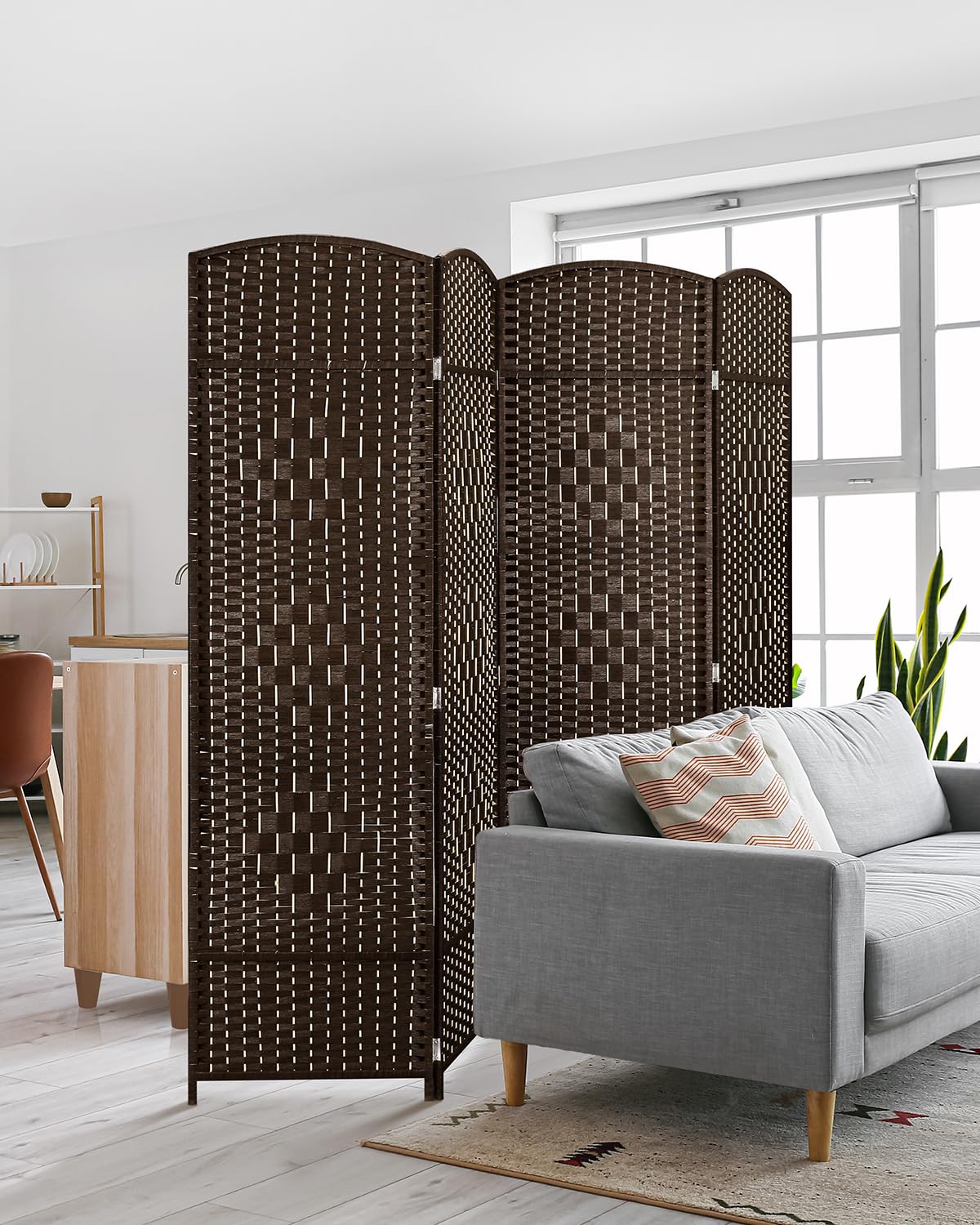 4-panel brown room divider displayed in a modern living room setting, positioned behind a gray sofa to create a stylish and functional private space.